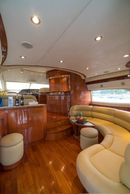 Open sun deck and lounge seating on a private charter yacht in Bali